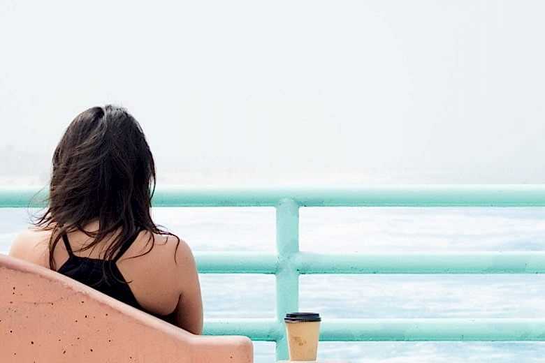 woman sitting alone outside
