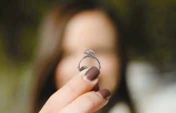 woman holding a engagement ring