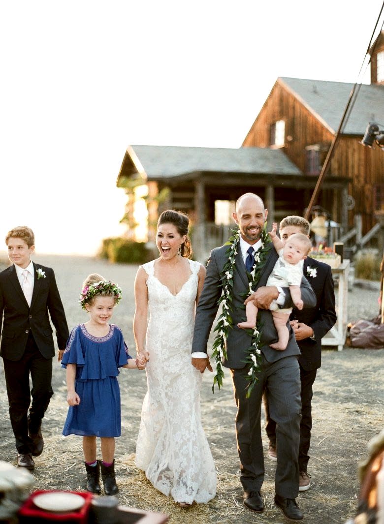blended family of six walking during wedding