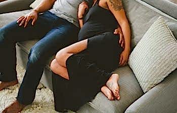 couple sitting together on the couch