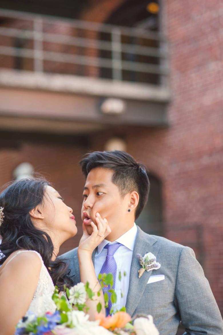 a couple making faces during their wedding