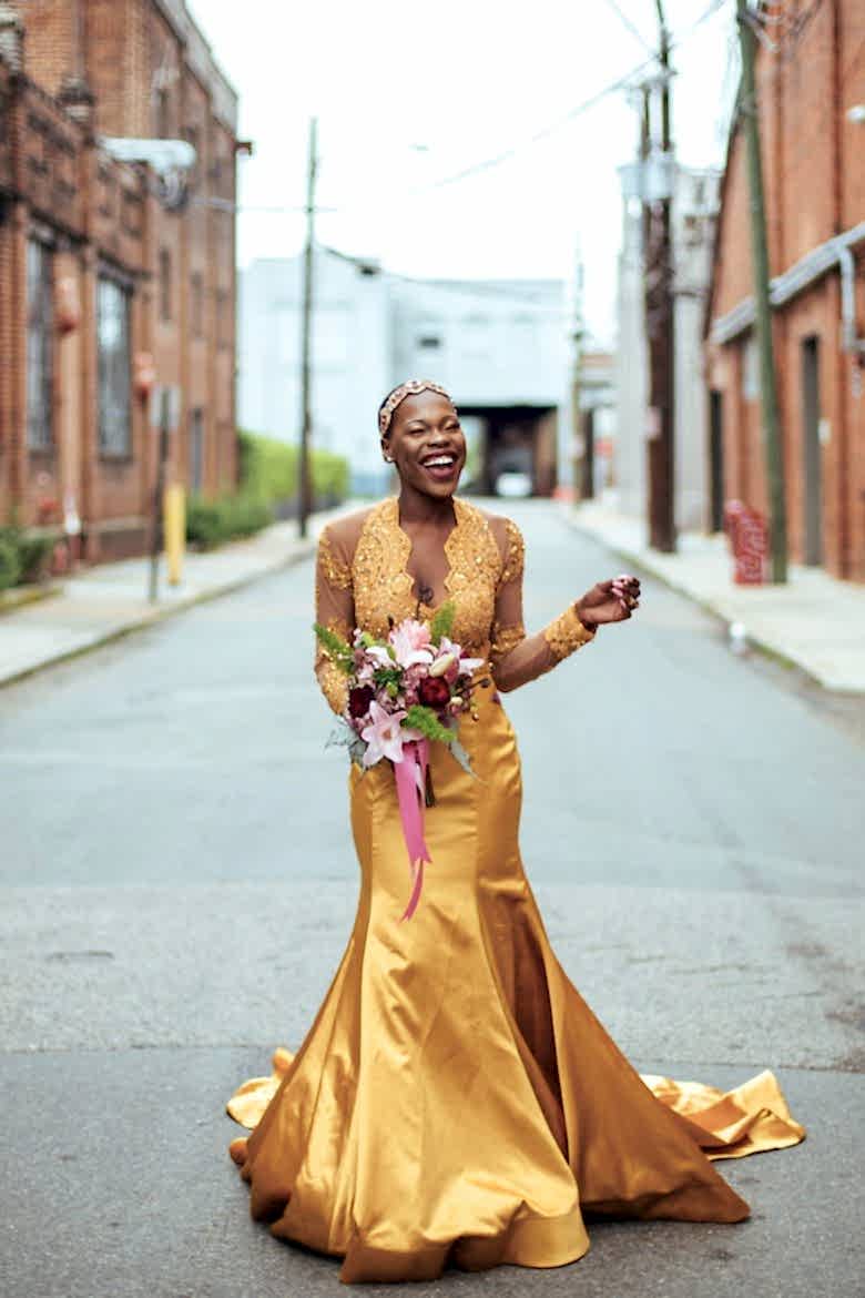 bride in a golden wedding gown by a lovely photo