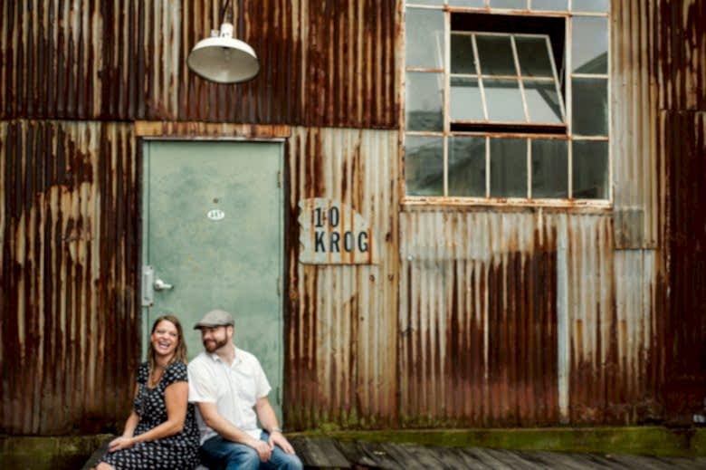a couple sitting for engagement photos