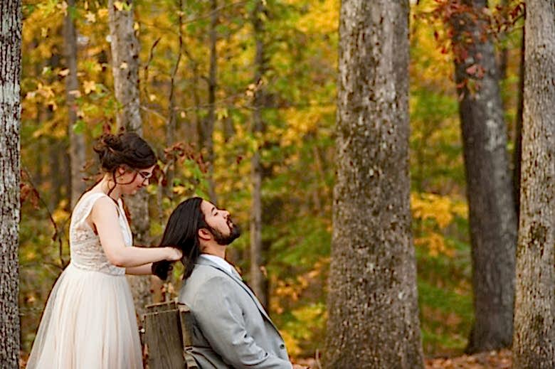 a bride cutting the groom's hair