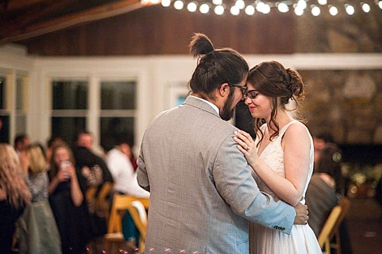 a couple during their first dance by you are raven