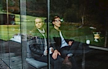man and woman sitting together
