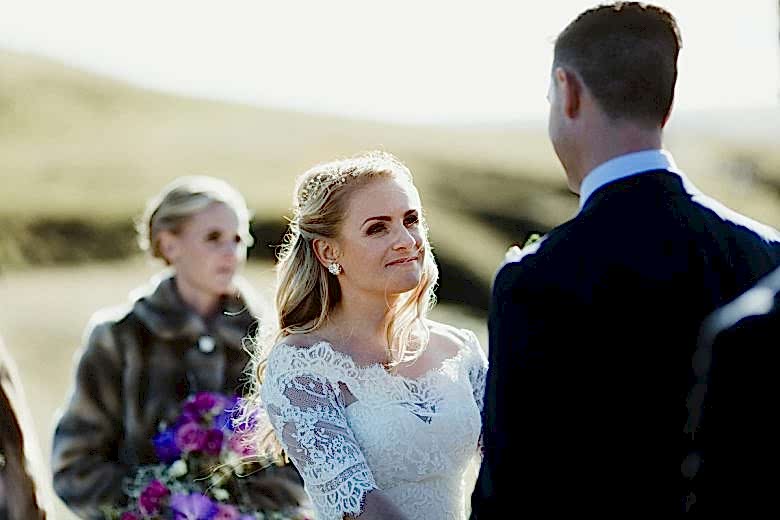 Bride looking at groom during ceremony