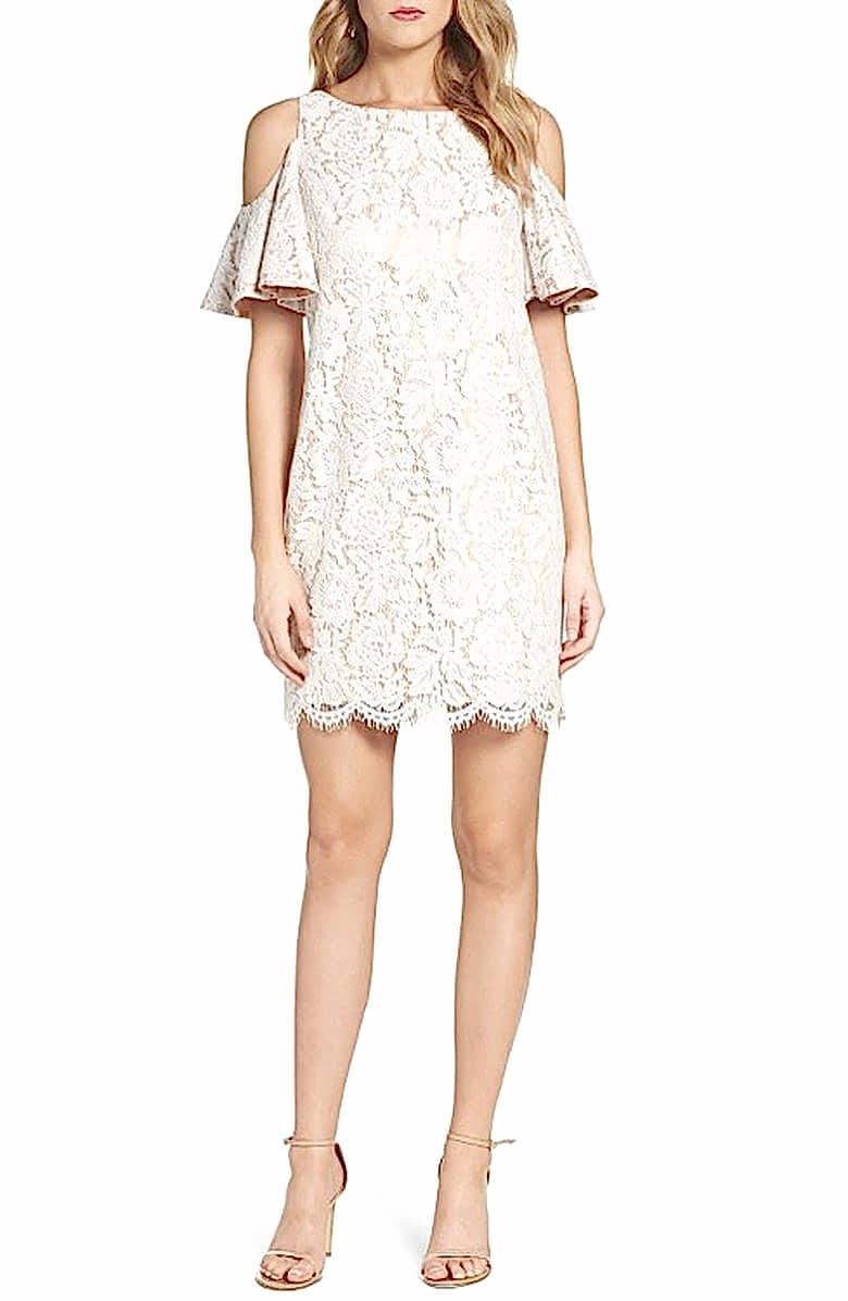 woman in cold shoulder lace mini-shift