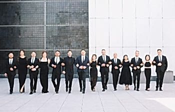 Long line of bridesmaids and groomsmen in black