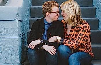 two queer women sitting on steps