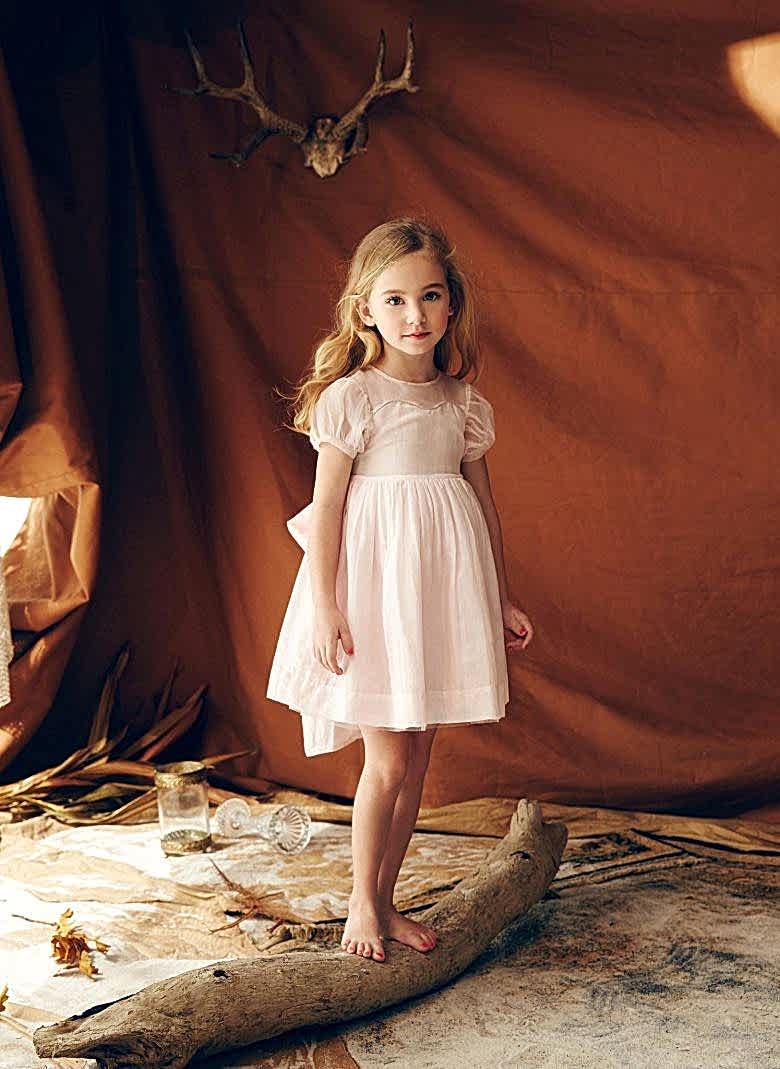 old fashioned pink dress on a little girl