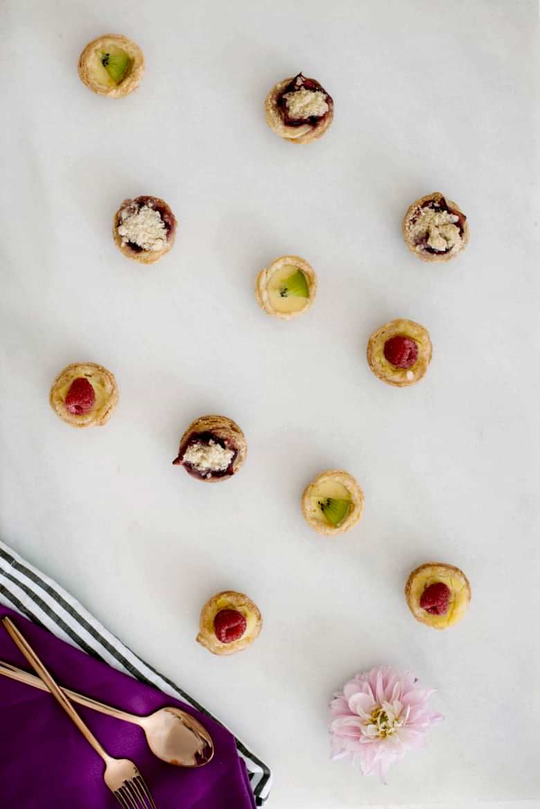 mini pies on marble board with copper utensils 