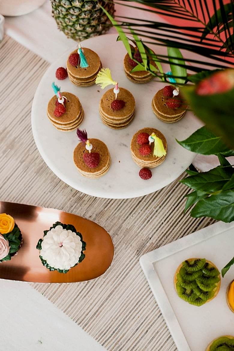 brunch buffet spread from above on copper and marble serving platters
