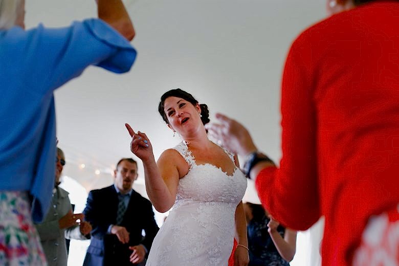 Bride in center of dance circle at reception