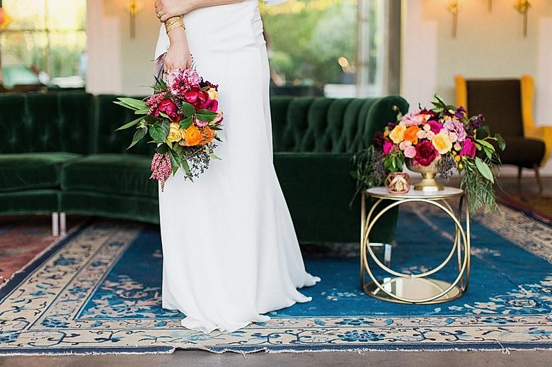 Low angle view of bride in the middle of the room, alone, facing you the viewer.