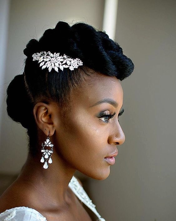 woman's profile with hair in a faux-hawk twist, accented with jeweled hairpiece
