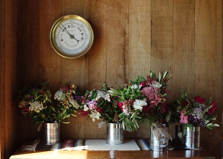 bridal bouquets in tin cans