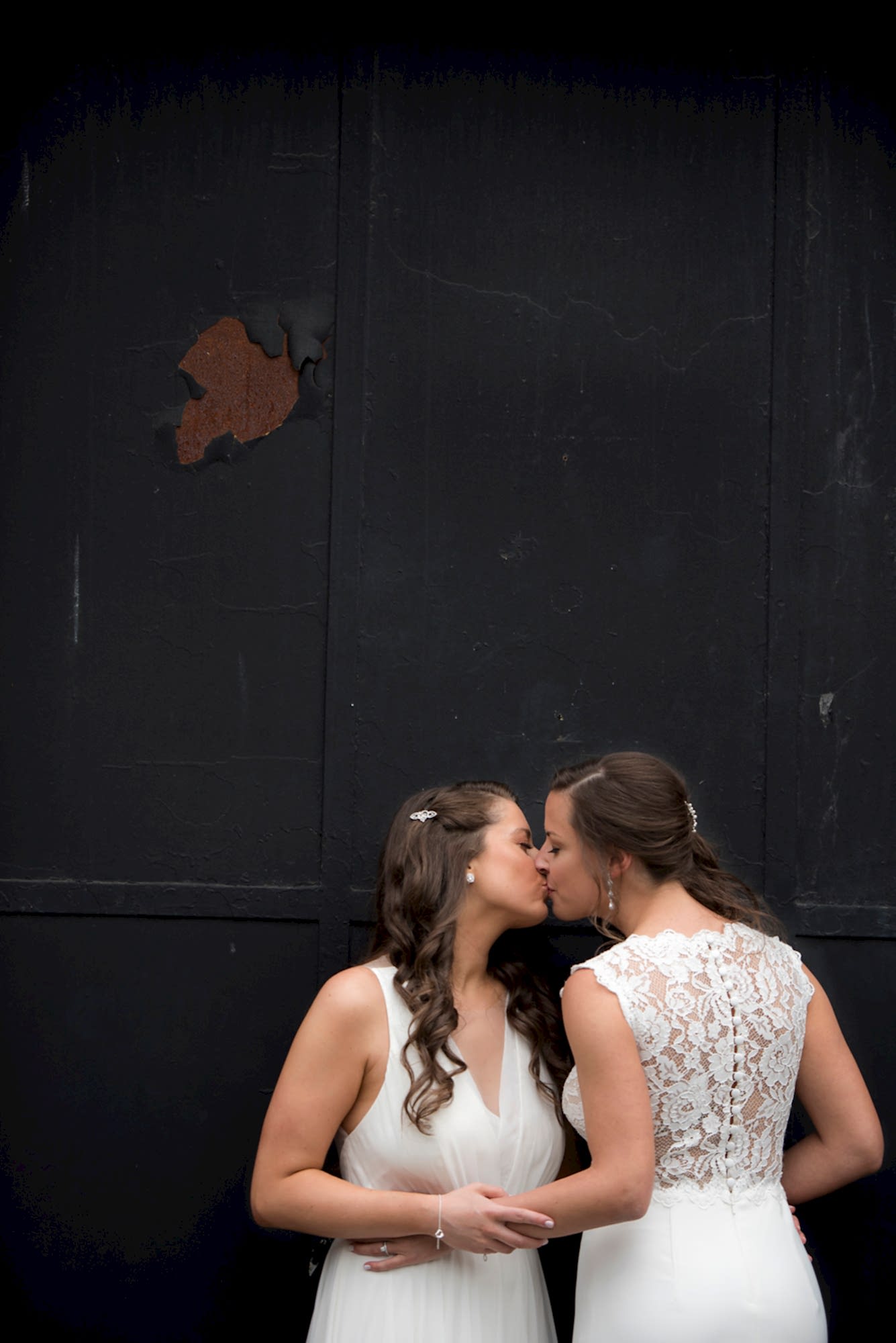 Two women kiss on their wedding day