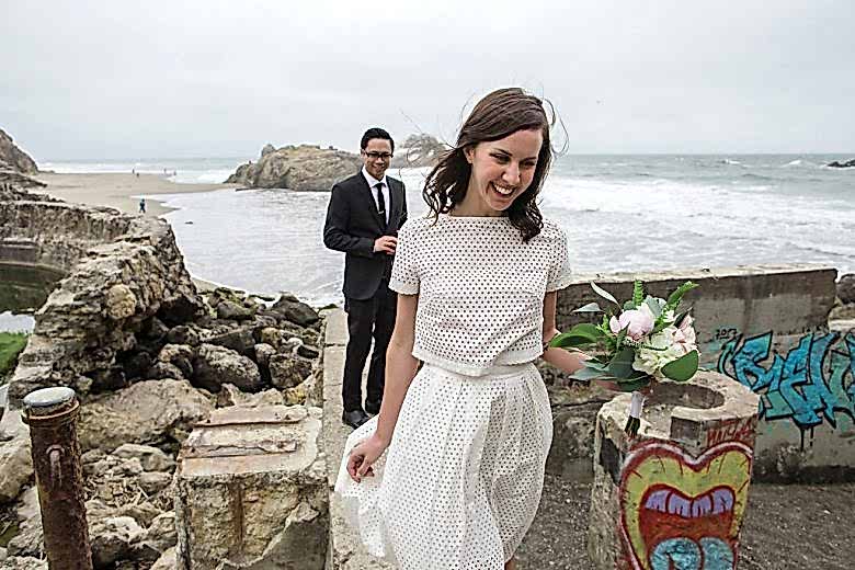 happy wedding couple on the beach in a Gina Clyne photo