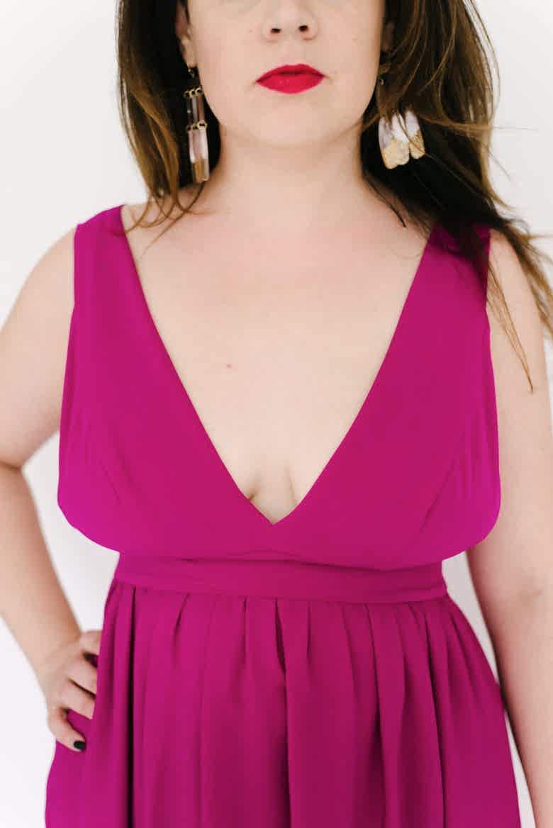 closeup of deep v neckline in pink dress