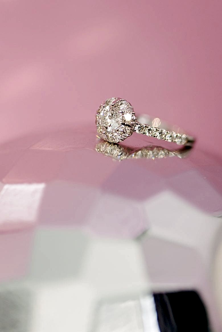 macy's star signature diamond engagement ring sitting on a disco ball