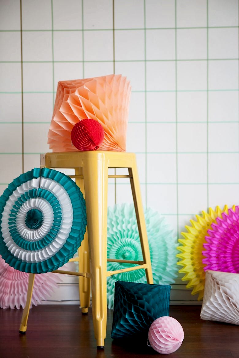 tissue honeycomb diamonds and pinwheels on yellow metal stool