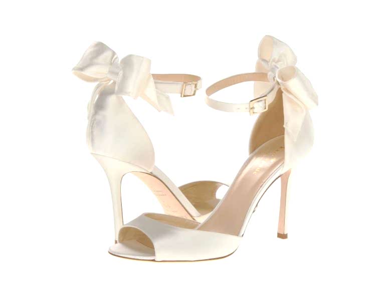 white wedding heels with a bow and a high heel