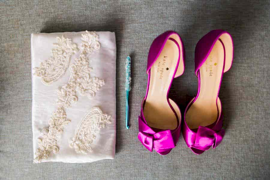 white appliqué clutch, crochet hook, and fuchsia kate spade shoes