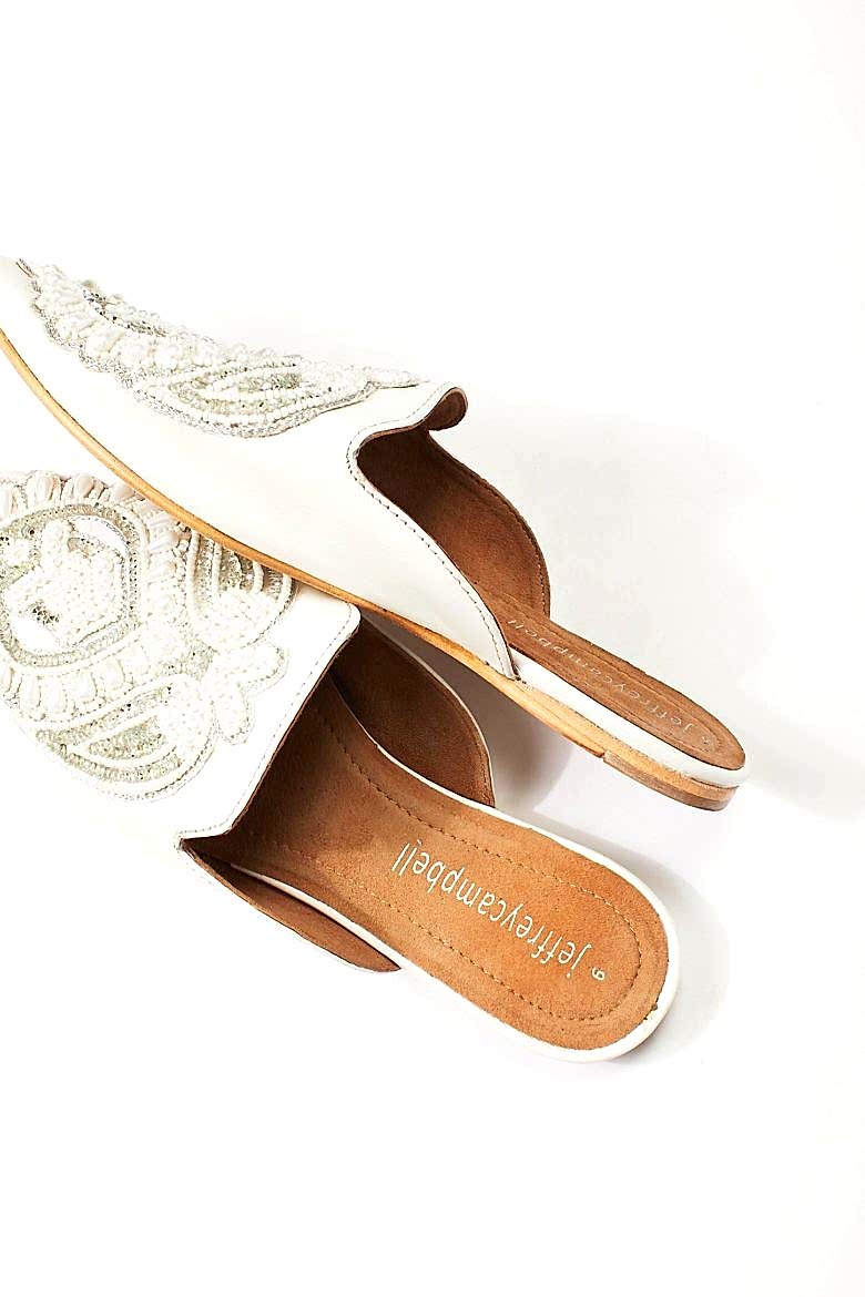 white embellished mules