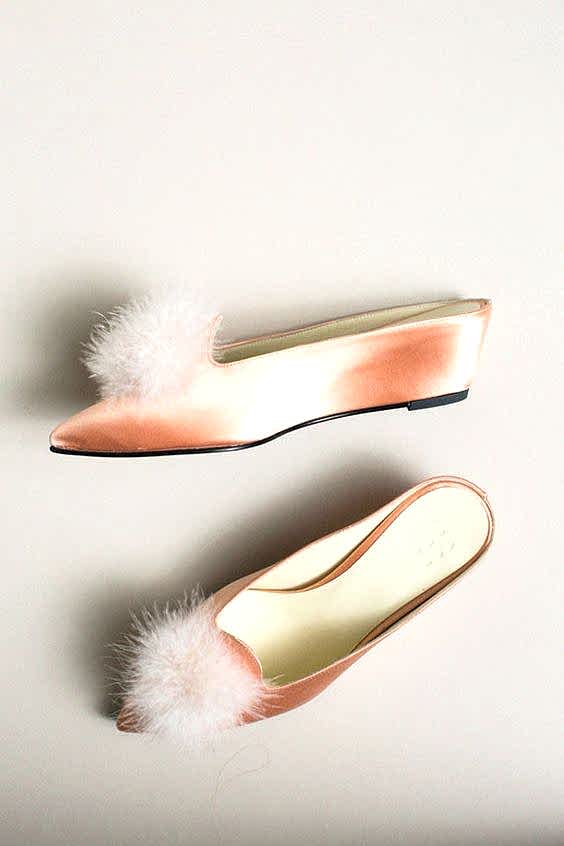 peach shoes with furry tuft on the top