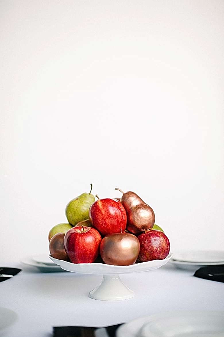 spray painted fruit on west elm cake stand