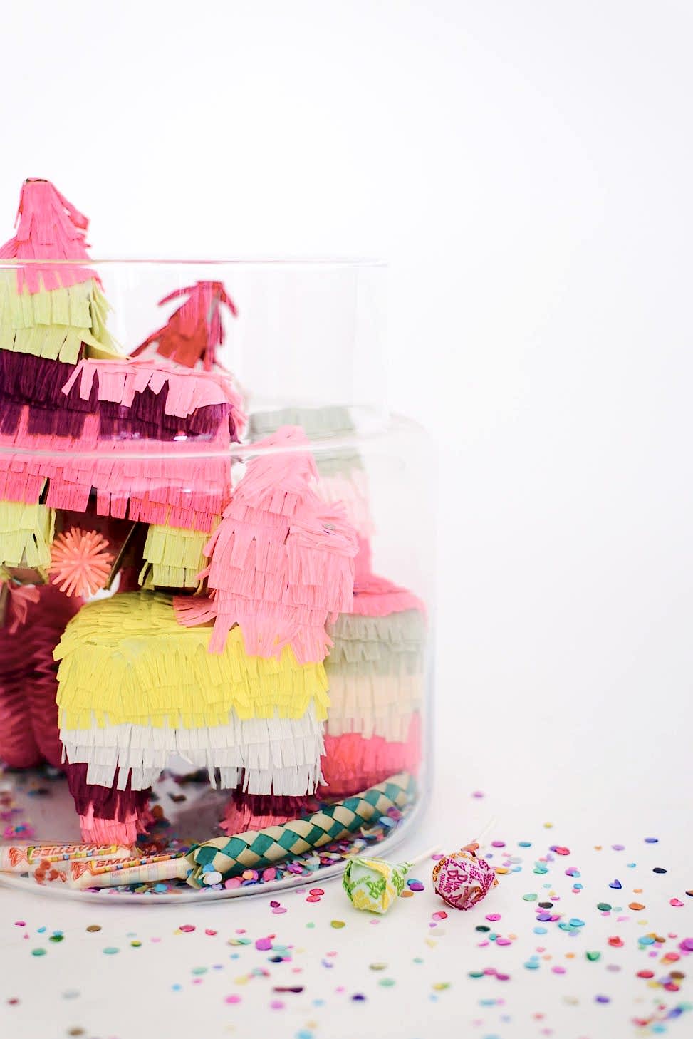 wedding party terrarium with pink and yellow mini pinatas