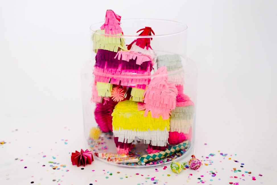 wedding party terrarium with pink and yellow mini pinatas