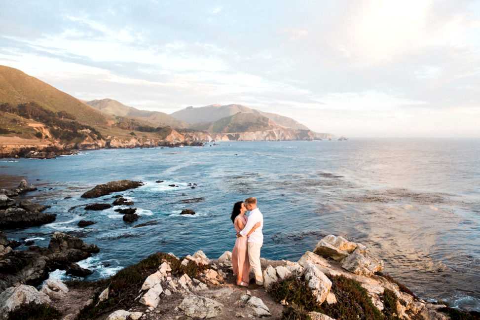 Couple hugging at the ocean