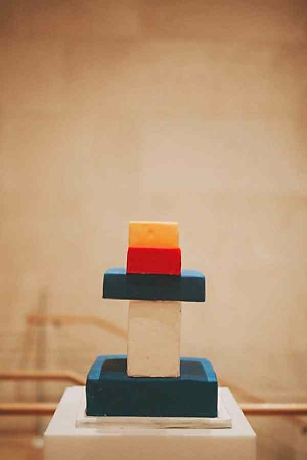 blue, white, red, and yellow art deco cake