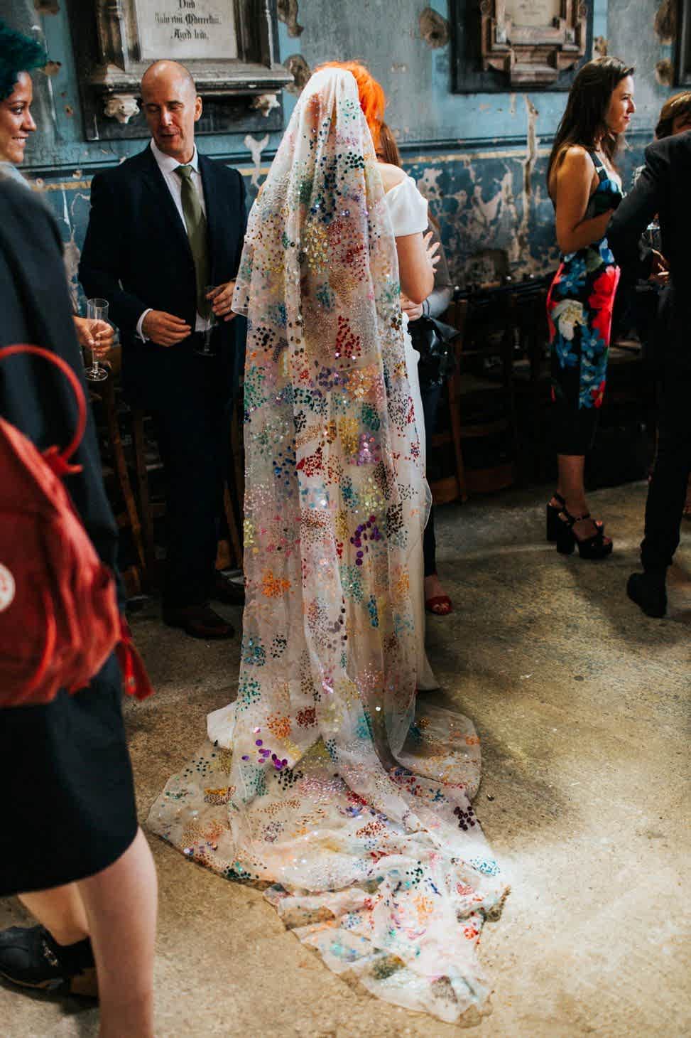 bride with colorful bedazzled wedding veil
