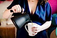 woman pouring from a teakettle