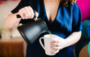 woman pouring from a teakettle
