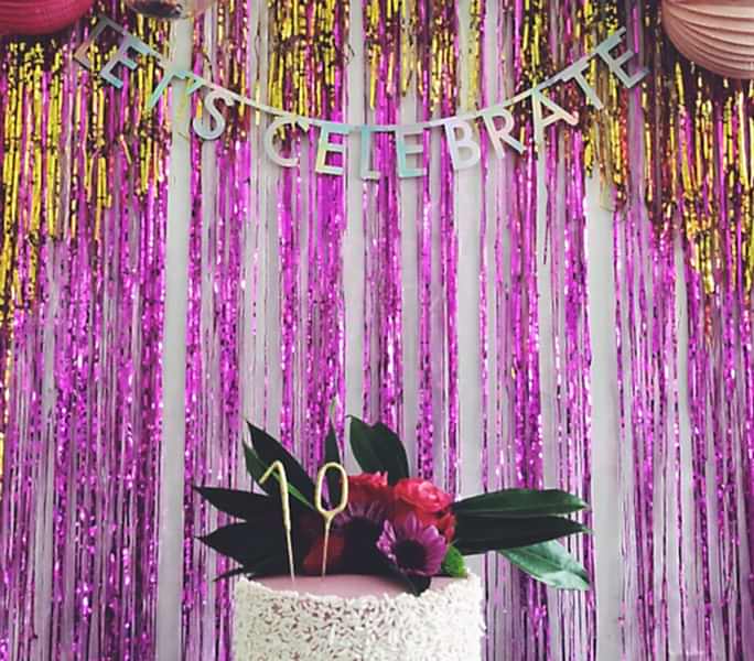 crepe balls and baubles with Let's Celebrate Banner and 10 on a cake.