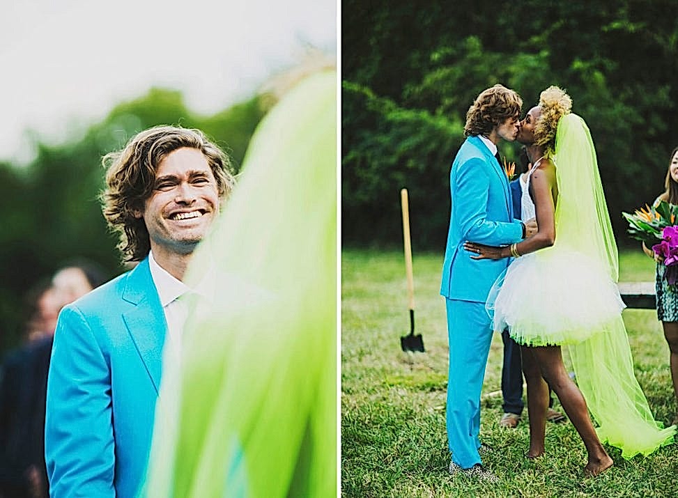 couple in neon formal wear kissing