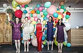 Bride with her maid of honor and wedding party