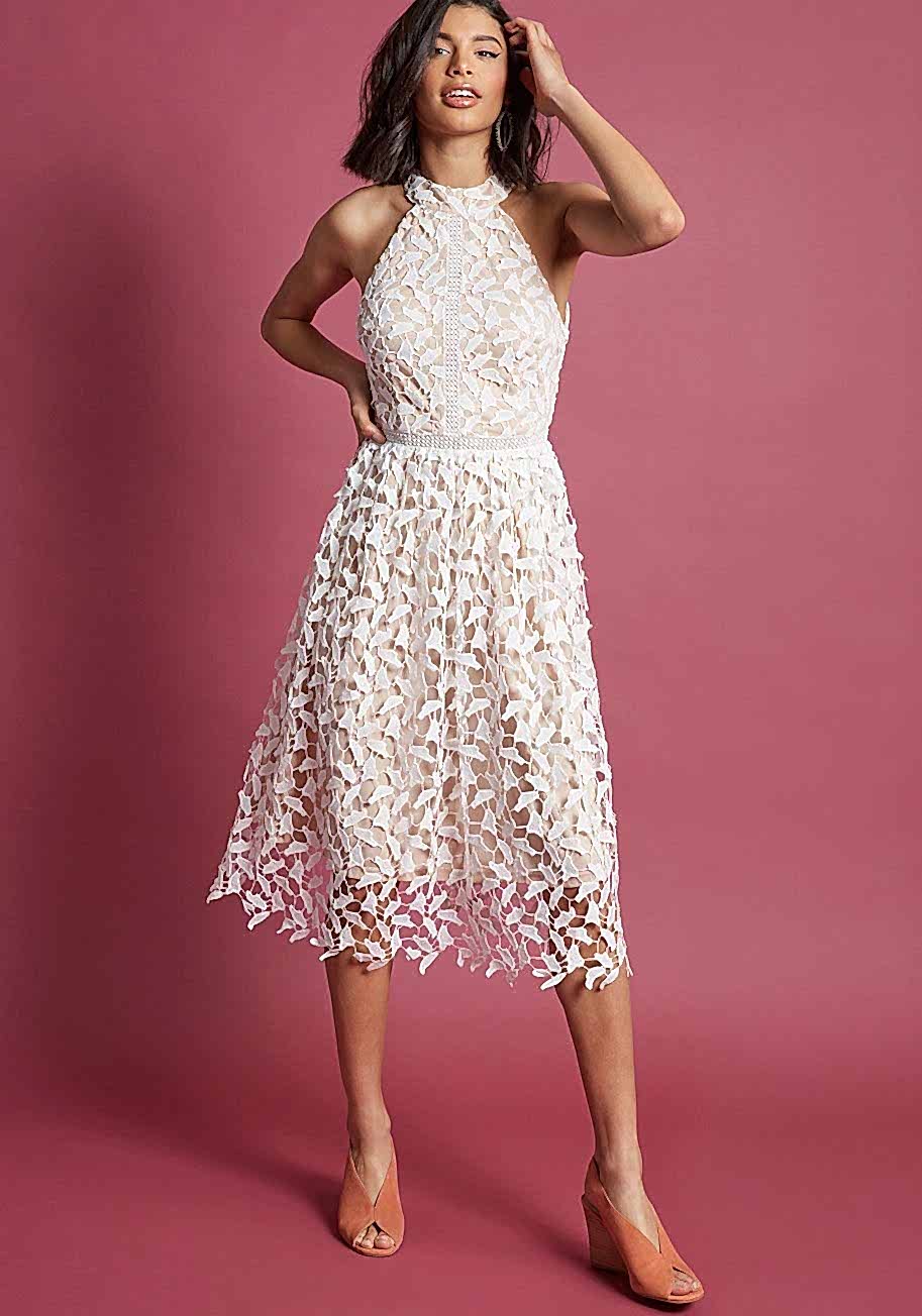woman wearing a dress with white lace leaves