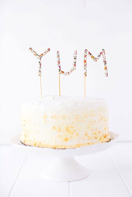 floral paper straws made into letters cake topper