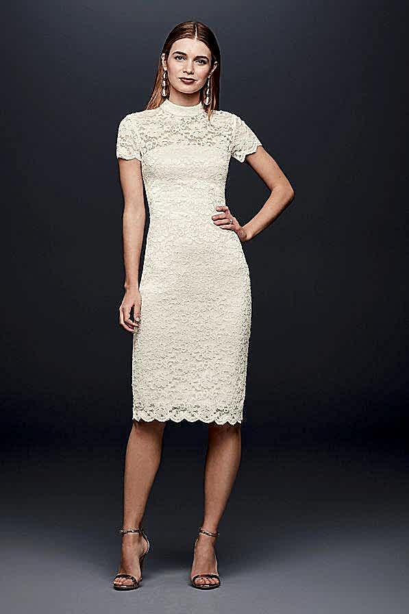woman wearing a lace mock turtle neck dress