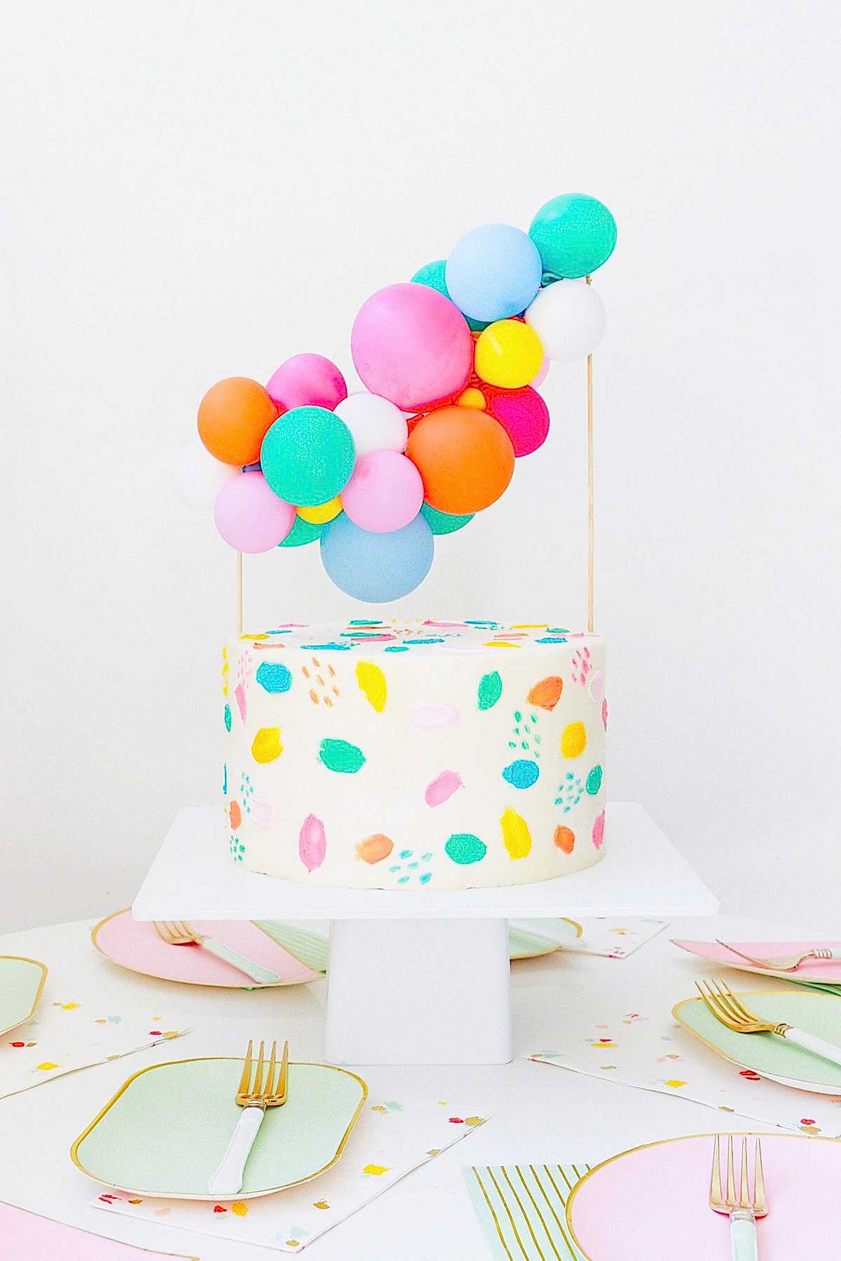 colorful mini balloon installment cake topper