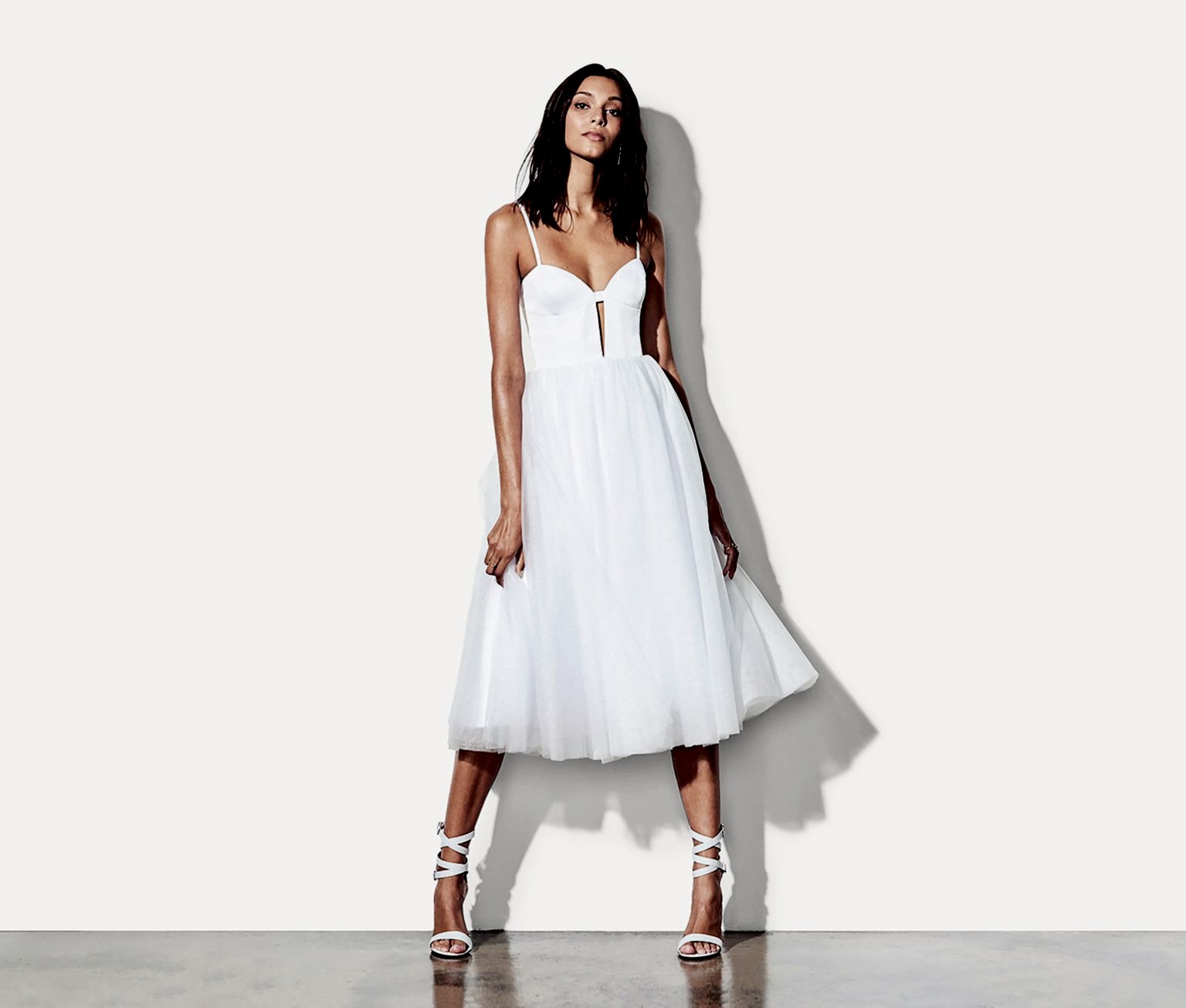 woman wearing a dress with cutouts and tulle