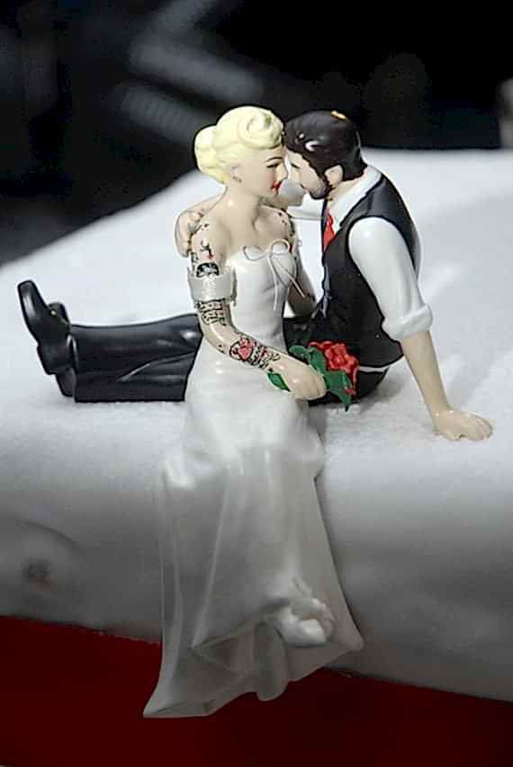 tattooed couple sitting cake topper