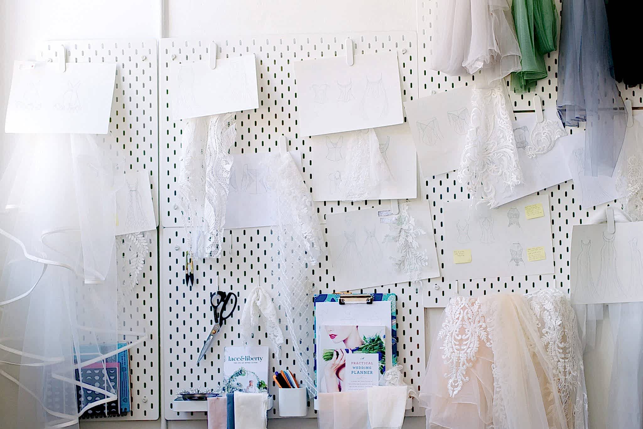 different fabric samples hang on a wall