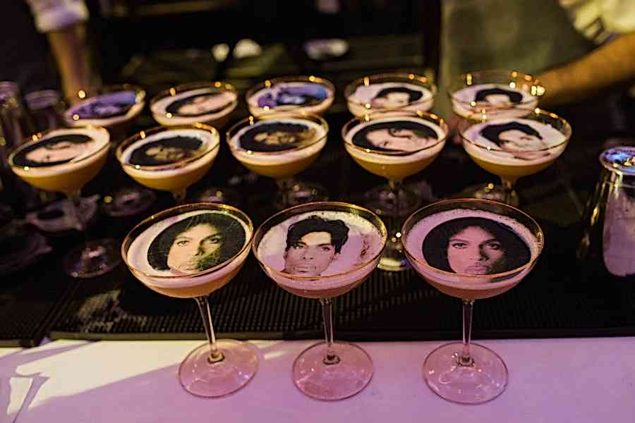 Close up of cocktail glasses with faces
