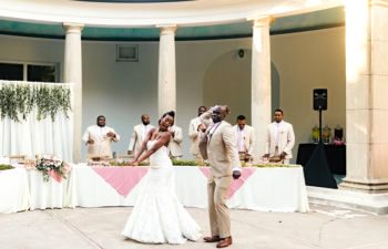 a bride and groom dance during their reception